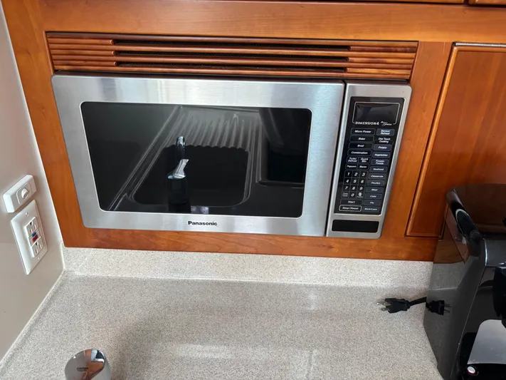  Yacht Photos Pics Built-in Panasonic microwave in a 2004 Riviera 4000 yacht kitchen.