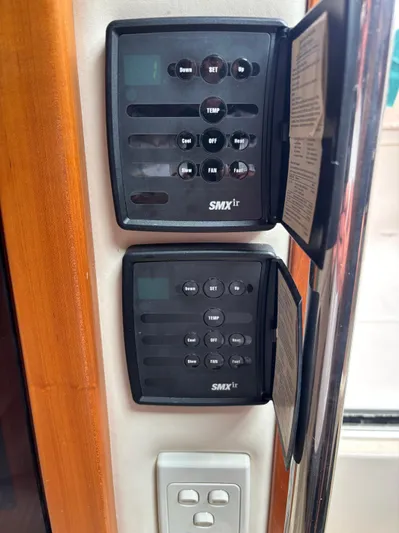  Yacht Photos Pics Control panels on a 2004 Riviera 4000 boat, featuring SMXir systems.