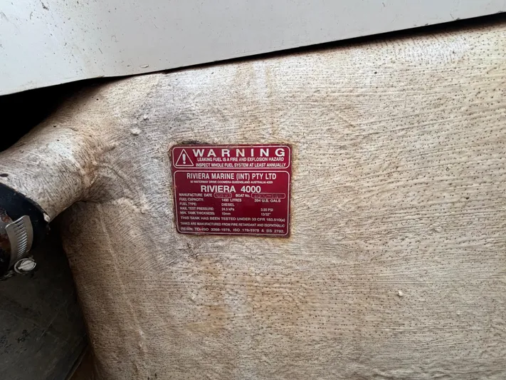  Yacht Photos Pics Red warning label on a 2004 Riviera 4000 boat fuel tank.