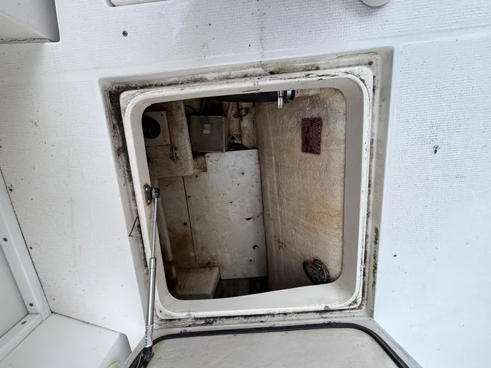  Yacht Photos Pics Open hatch of a 2004 Riviera 4000 boat, showing interior compartment.