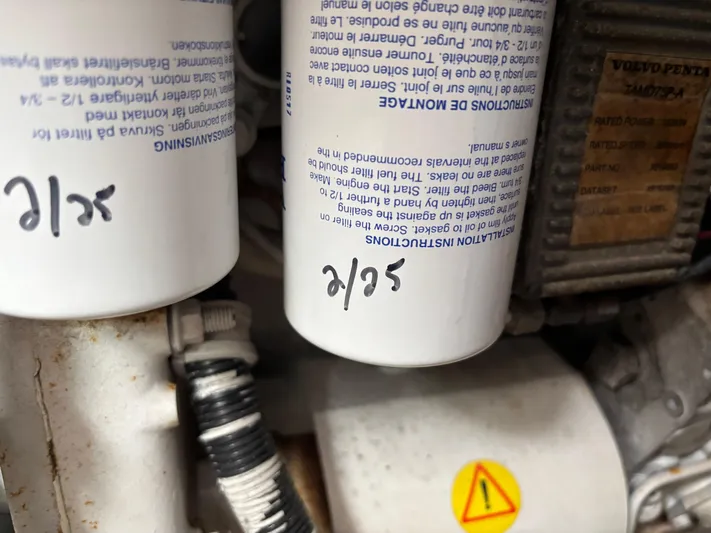  Yacht Photos Pics Close-up of engine filters in a 2004 Riviera 4000 boat.