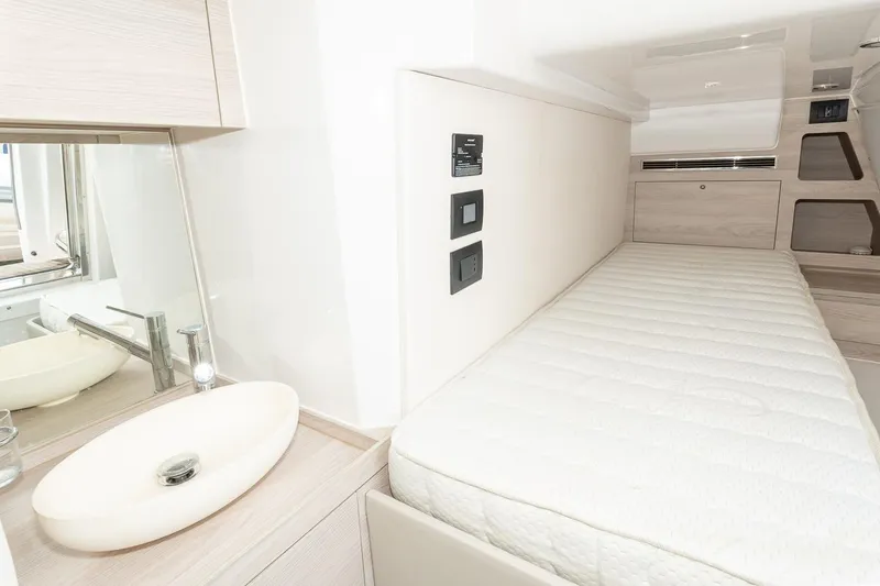 II Zoes Yacht Photos Pics 2023 Azimut Fly 53 yacht interior with modern sink and cozy bed.