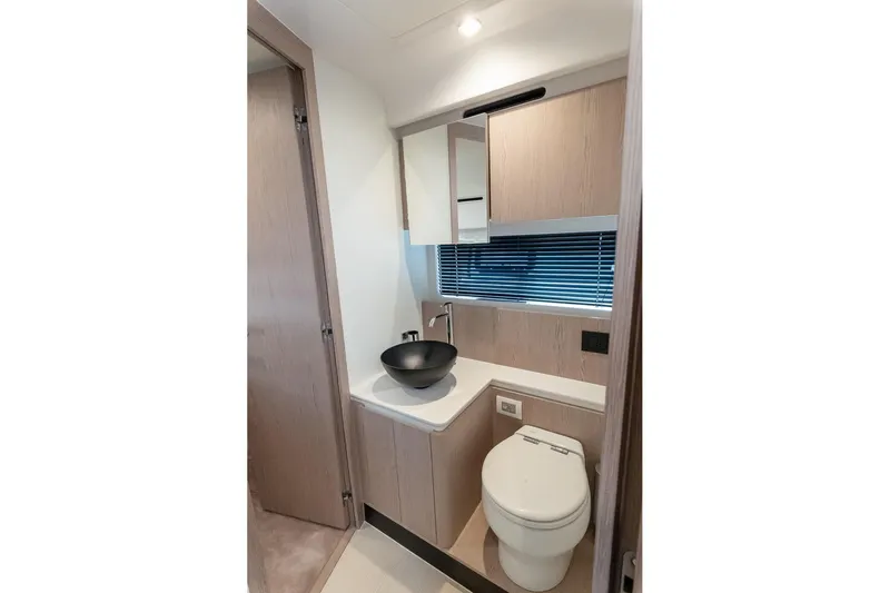 II Zoes Yacht Photos Pics Modern bathroom interior on 2023 Azimut Fly 53 yacht, featuring sleek design and fixtures.