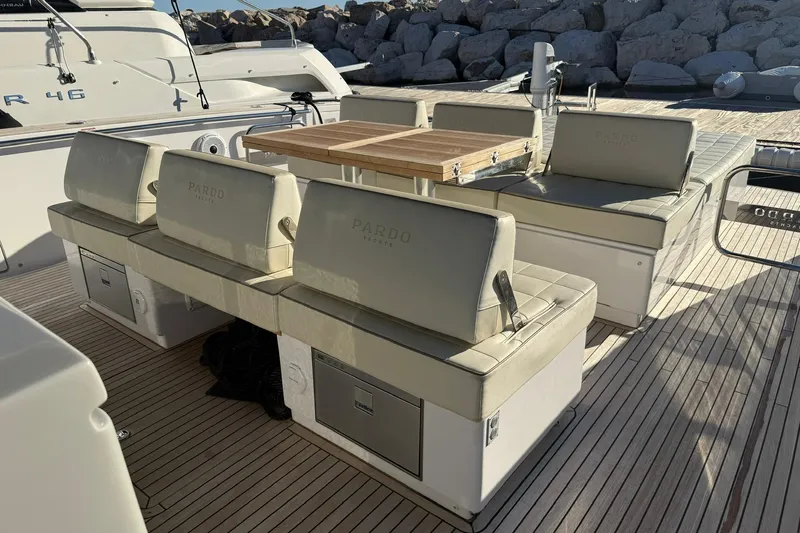 Seoi Yacht Photos Pics Luxurious seating area on 2024 Pardo Yachts P43 with elegant wooden table.