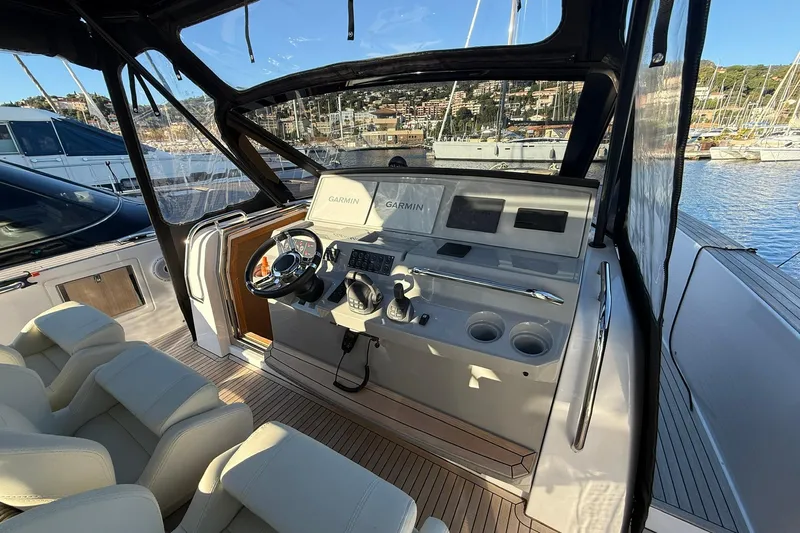 Seoi Yacht Photos Pics 2024 Pardo Yachts P43 helm with Garmin navigation, luxurious seating, and marina view.