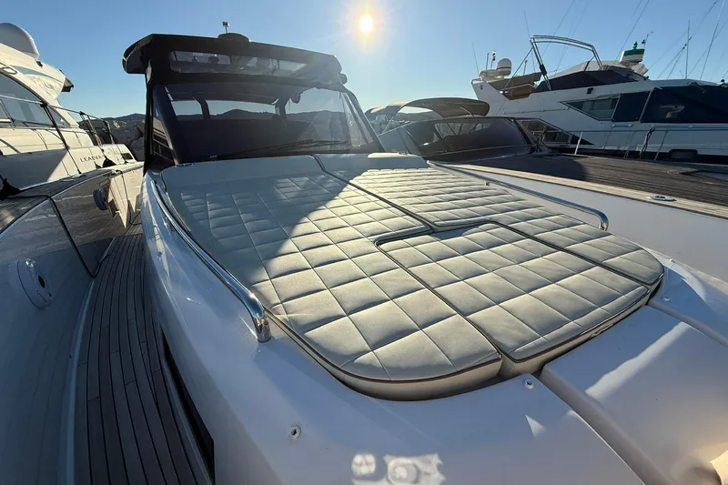 Seoi Yacht Photos Pics 2024 Pardo Yachts P43 with sun pad, docked under clear sky.