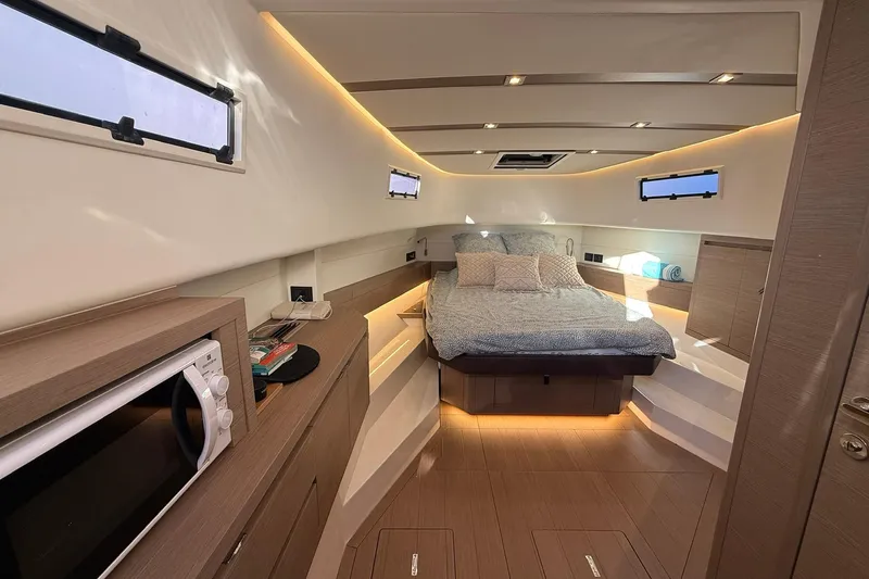 Seoi Yacht Photos Pics Luxurious interior of 2024 Pardo Yachts P43 with cozy bed and modern amenities.