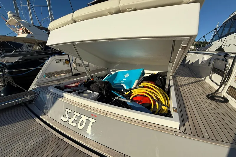 Seoi Yacht Photos Pics 2024 Pardo Yachts P43 storage compartment open, revealing various boating equipment.