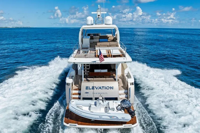 Elevation Yacht Photos Pics Luxury yacht Prestige 750 cruising on open sea, 2016 model, with clear blue skies.