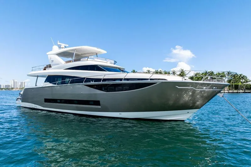 Elevation Yacht Photos Pics Luxury 2016 Prestige 750 yacht on clear blue water, sunny day.