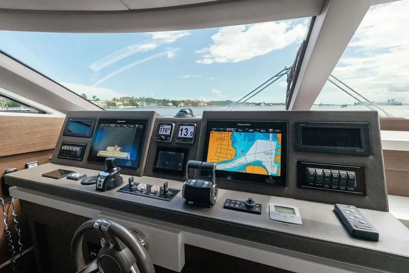 Elevation Yacht Photos Pics Helm of 2016 Prestige 750 yacht with navigation screens and controls.