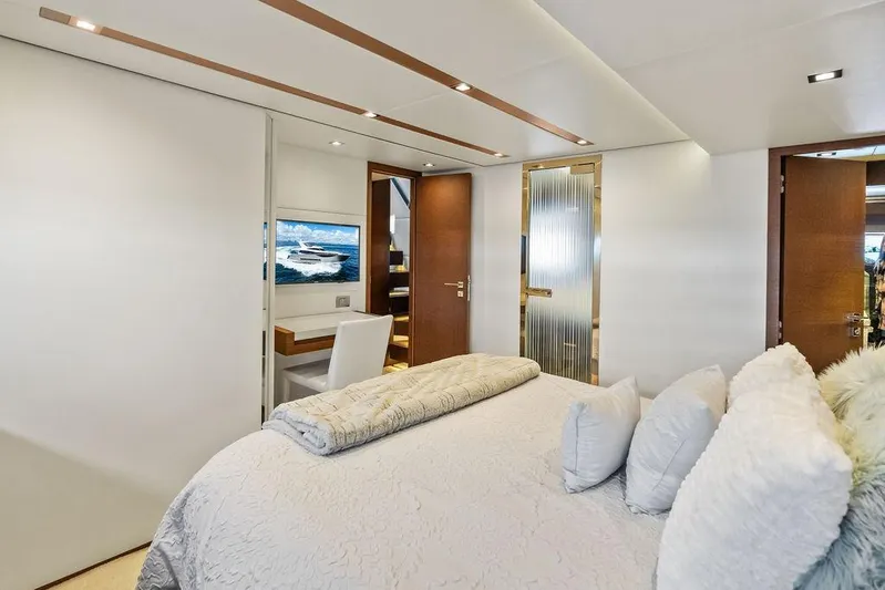 Elevation Yacht Photos Pics Luxurious bedroom interior of 2016 Prestige 750 yacht with elegant decor and modern amenities.