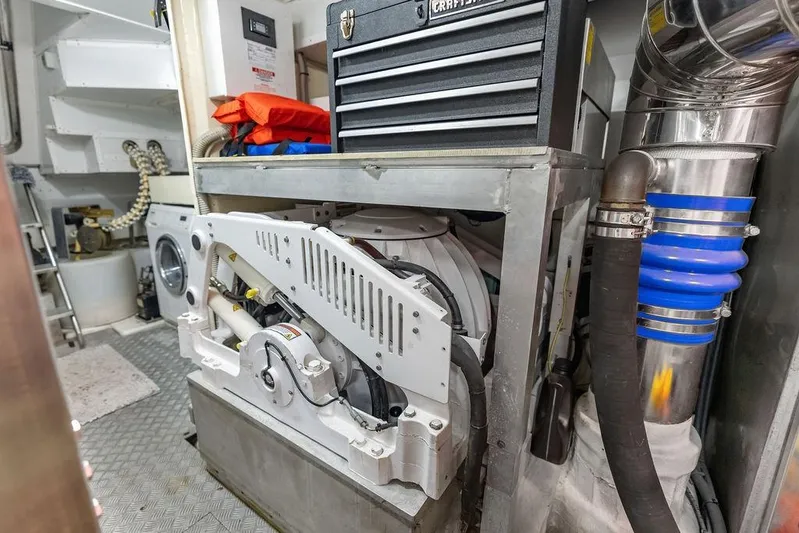 Elevation Yacht Photos Pics Engine room of 2016 Prestige 750 yacht with mechanical equipment and storage.