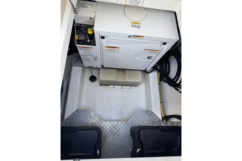 Swell Yacht Photos Pics Engine compartment of a 2020 Back Cove 34O boat, featuring a generator and wiring.