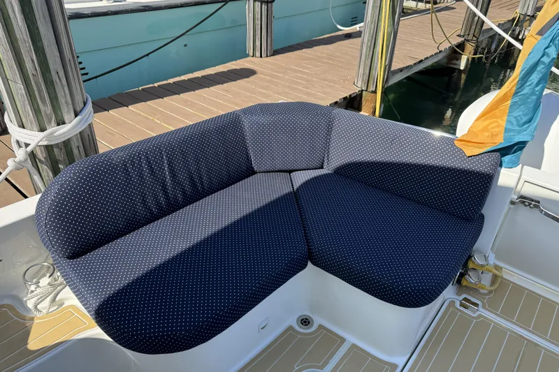 Swell Yacht Photos Pics Blue polka dot seating on 2020 Back Cove 34O boat at dock.