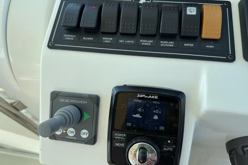 Swell Yacht Photos Pics Control panel of a 2020 Back Cove 34O boat with switches and Zipwake system.