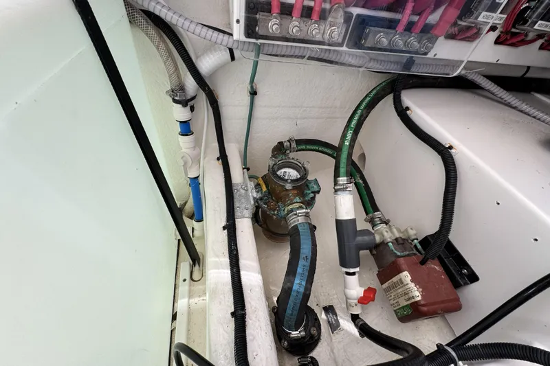 Swell Yacht Photos Pics Engine compartment of 2020 Back Cove 34O boat, showing hoses and electrical connections.