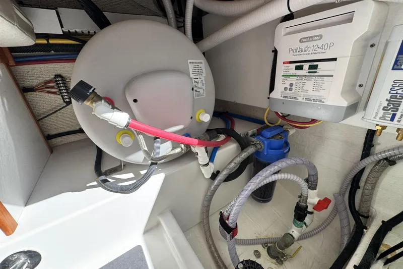 Swell Yacht Photos Pics 2020 Back Cove 34O engine compartment with ProMariner ProNautic charger and plumbing system.