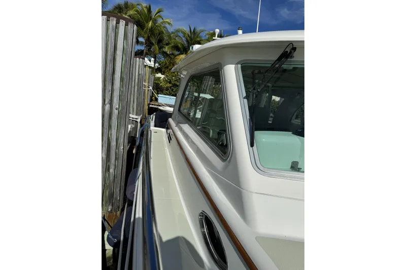 Swell Yacht Photos Pics 2020 Back Cove 34O yacht docked, showcasing sleek design and side view.