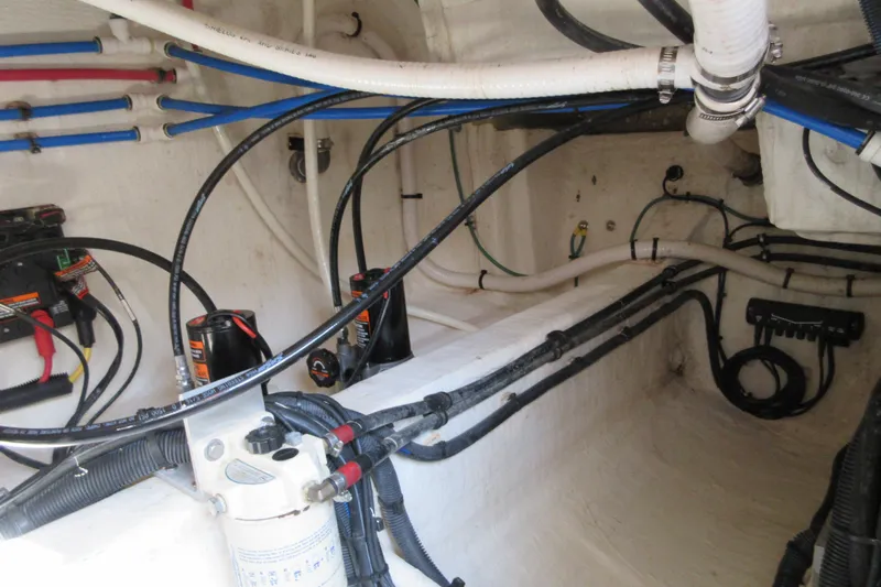 Swell Yacht Photos Pics Engine compartment of a 2020 Back Cove 34O boat, showcasing wiring and plumbing.