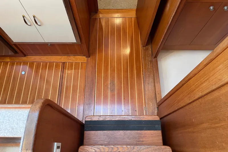 Mary Jean Too Yacht Photos Pics Wooden interior flooring and cabinetry of 2003 Mainship 430 Trawler boat.