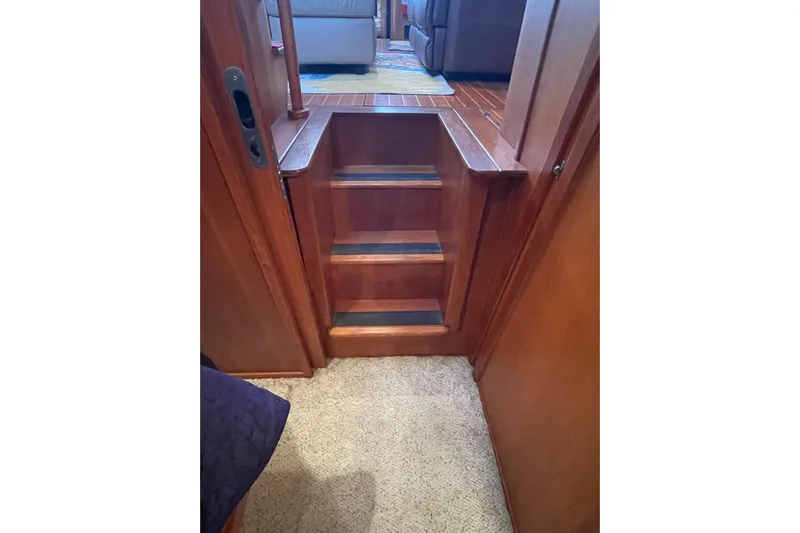Mary Jean Too Yacht Photos Pics Wooden interior stairs on a 2003 Mainship 430 Trawler yacht.