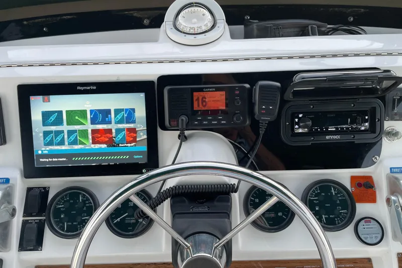 Mary Jean Too Yacht Photos Pics Helm of 2003 Mainship 430 Trawler with navigation and communication equipment.