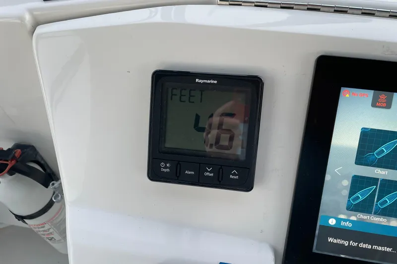 Mary Jean Too Yacht Photos Pics Depth gauge and navigation display on 2003 Mainship 430 Trawler dashboard.