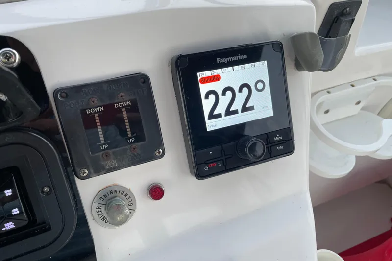 Mary Jean Too Yacht Photos Pics Control panel of 2003 Mainship 430 Trawler with Raymarine display showing 222 degrees.