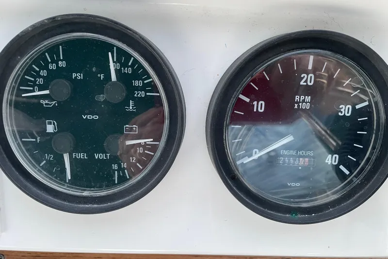 Mary Jean Too Yacht Photos Pics Close-up of 2003 Mainship 430 Trawler gauges displaying PSI, RPM, fuel, and engine hours.