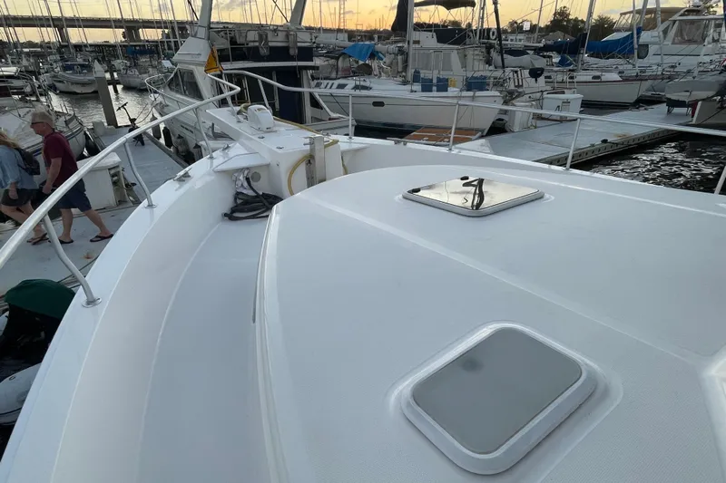 Mary Jean Too Yacht Photos Pics 2003 Mainship 430 Trawler docked at marina during sunset, with visible deck and hatches.