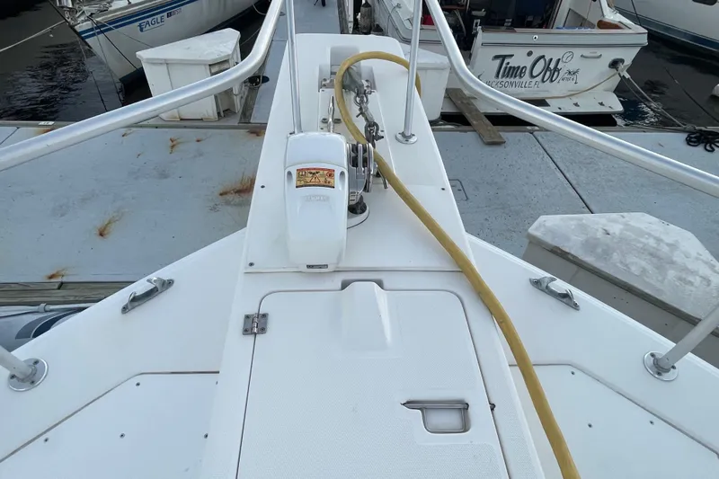 Mary Jean Too Yacht Photos Pics 2003 Mainship 430 Trawler deck with winch and railing at marina.