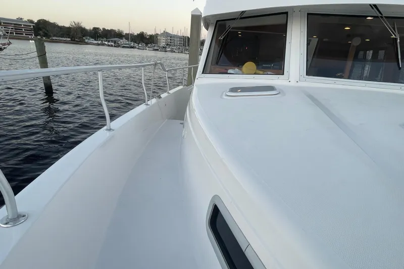 Mary Jean Too Yacht Photos Pics 2003 Mainship 430 Trawler deck view, docked by the water.
