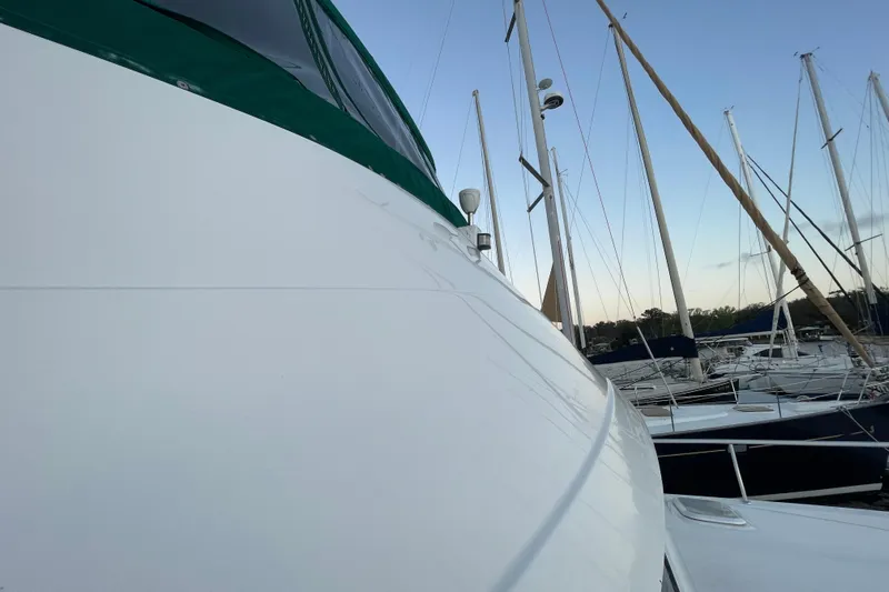 Mary Jean Too Yacht Photos Pics 2003 Mainship 430 Trawler docked at marina with sailboats in background.