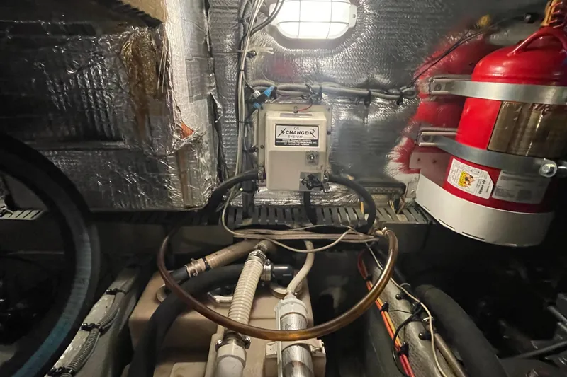 Mary Jean Too Yacht Photos Pics Engine room of 2003 Mainship 430 Trawler with oil change system and fire extinguisher.