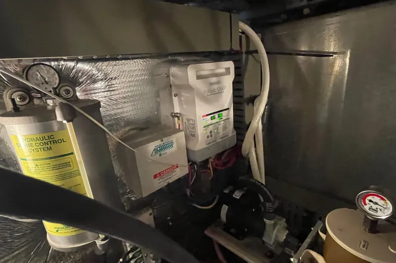 Mary Jean Too Yacht Photos Pics Engine room of 2003 Mainship 430 Trawler with hydraulic control system and electrical components.