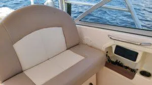  Yacht Photos Pics 2013 Grady-White Freedom 307 boat interior with beige seating and ocean view.