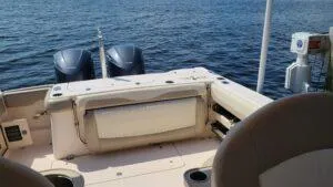  Yacht Photos Pics 2013 Grady-White Freedom 307 boat interior with dual engines on open water.