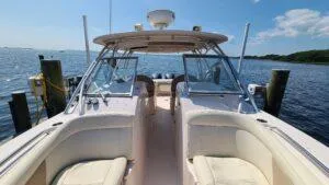  Yacht Photos Pics 2013 Grady-White Freedom 307 boat docked by the water on a sunny day.