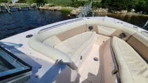  Yacht Photos Pics 2013 Grady-White Freedom 307 boat with spacious seating, docked by a scenic waterfront.