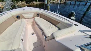  Yacht Photos Pics 2013 Grady-White Freedom 307 boat interior with beige seating and waterfront view.