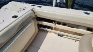  Yacht Photos Pics 2013 Grady-White Freedom 307 boat interior with beige seating and storage compartments.