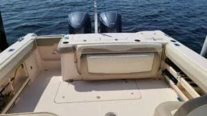  Yacht Photos Pics 2013 Grady-White Freedom 307 boat deck with dual outboard motors on water.