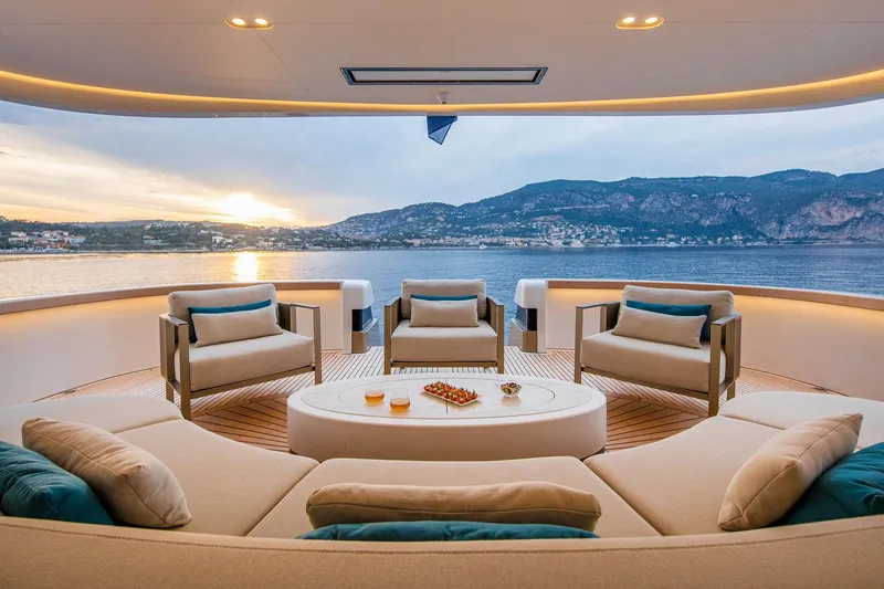 Lady Lene Yacht Photos Pics Luxurious yacht deck with elegant seating, ocean view, and sunset; Van der Valk Custom 34M Explorer 2021.