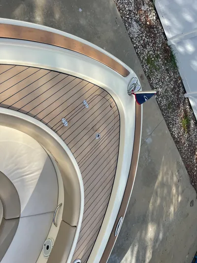  Yacht Photos Pics 2022 Chris-Craft Catalina 30 boat deck with elegant wood finish and seating area.