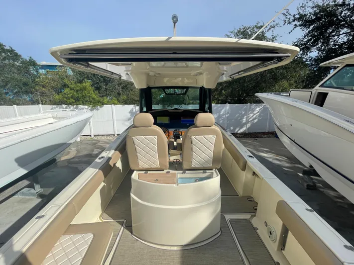  Yacht Photos Pics 2022 Chris-Craft Catalina 30 boat interior with beige seating and modern helm.