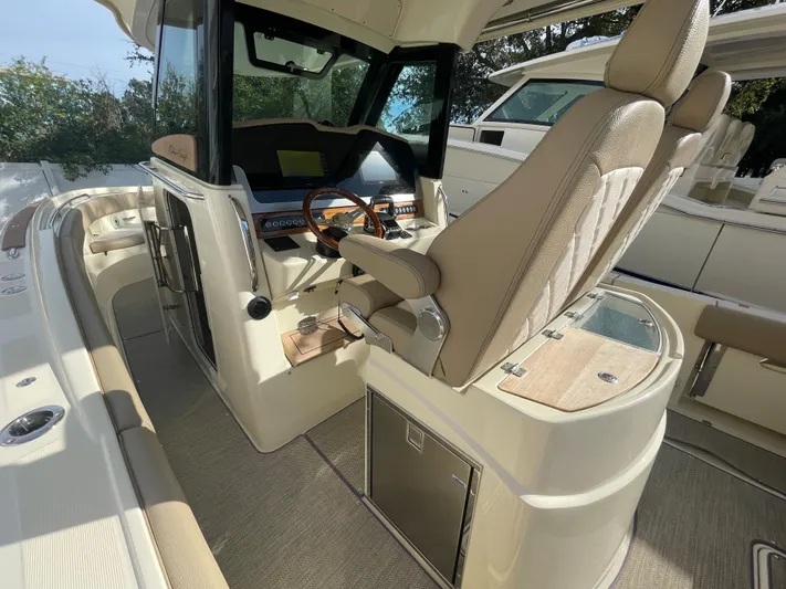  Yacht Photos Pics 2022 Chris-Craft Catalina 30 helm with luxurious seating and modern dashboard.