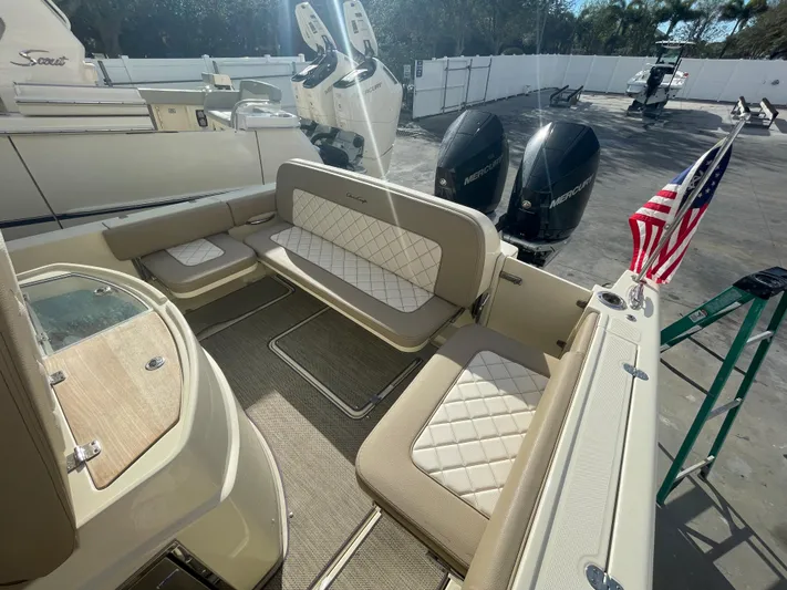  Yacht Photos Pics 2022 Chris-Craft Catalina 30 boat interior with seating and American flag.