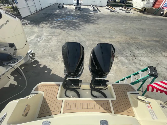  Yacht Photos Pics 2022 Chris-Craft Catalina 30 with dual outboard engines on display at a marina.