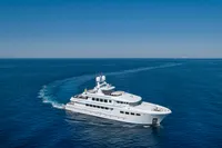 Luxurious 2004 R.B Dereli yacht cruising on open blue sea under clear sky.